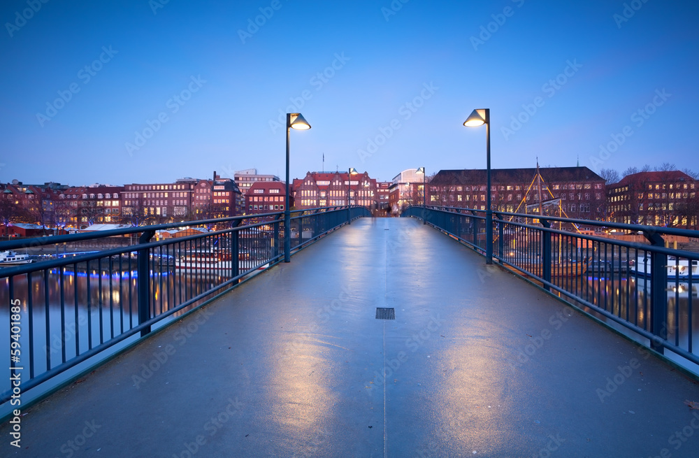 Fototapeta premium view on city Bremen from bridge in dusk