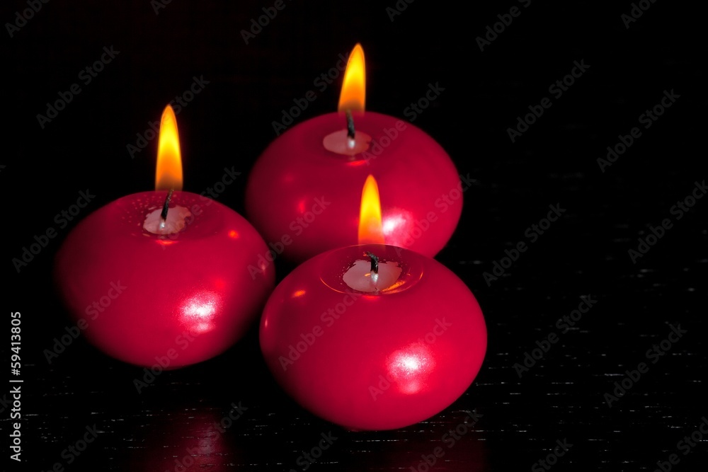 top of view of red christmas candles on wood table background