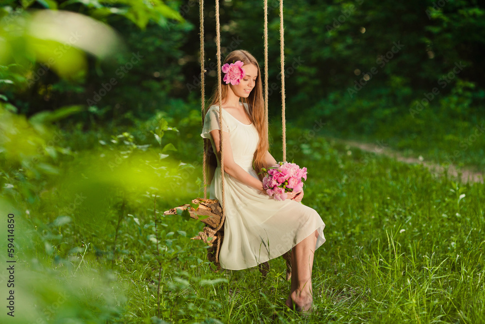 beautiful girl with bouquet of flowers in outdoor