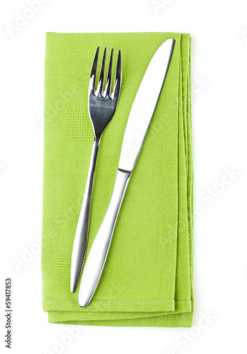 Silverware or flatware set of fork and knife on towel