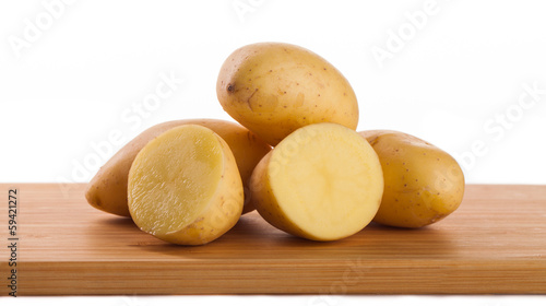 potatoes on board  isolated on white