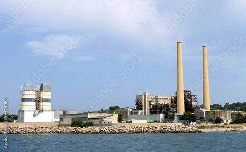 Industrial factory with tall chimney