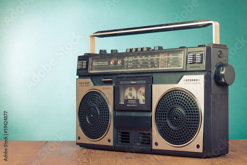 Retro ghetto blaster cassette tape recorder on table photo