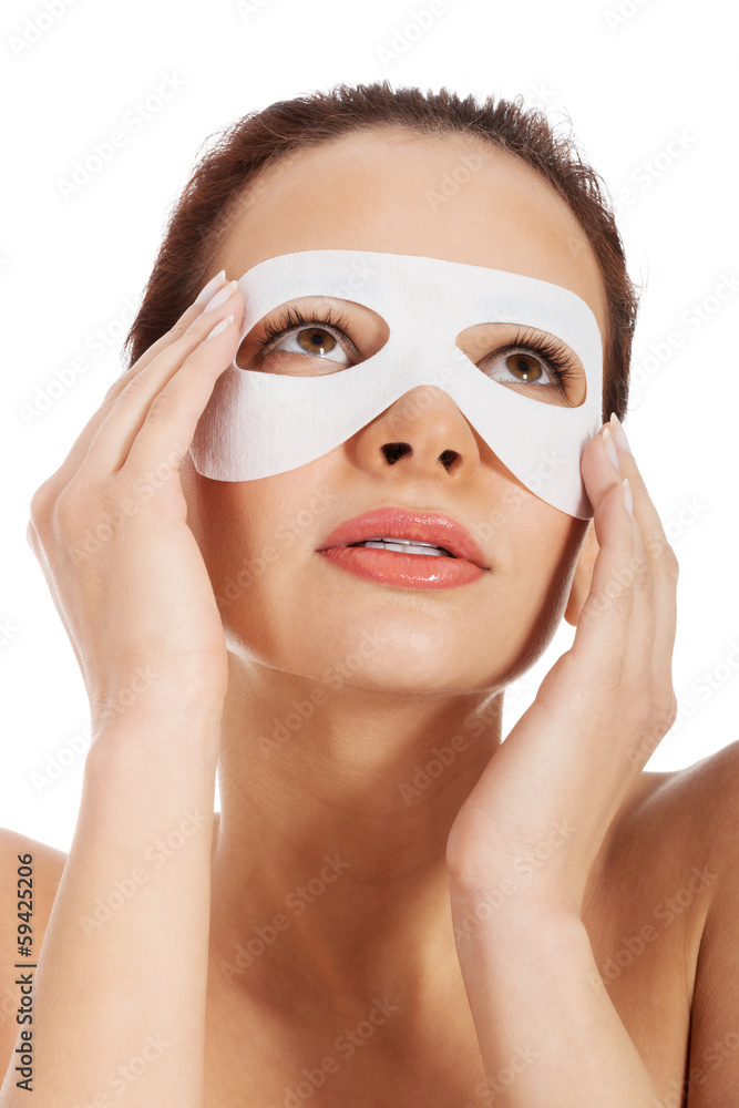 Beautiful woman with collagen mask on eyes. Beautiful woman with collagen mask on eyes.