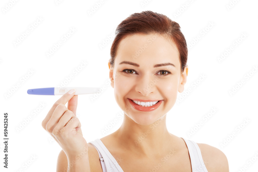 Happy beautiful young woman with pregnancy test. Happy beautiful young woman with pregnancy test.