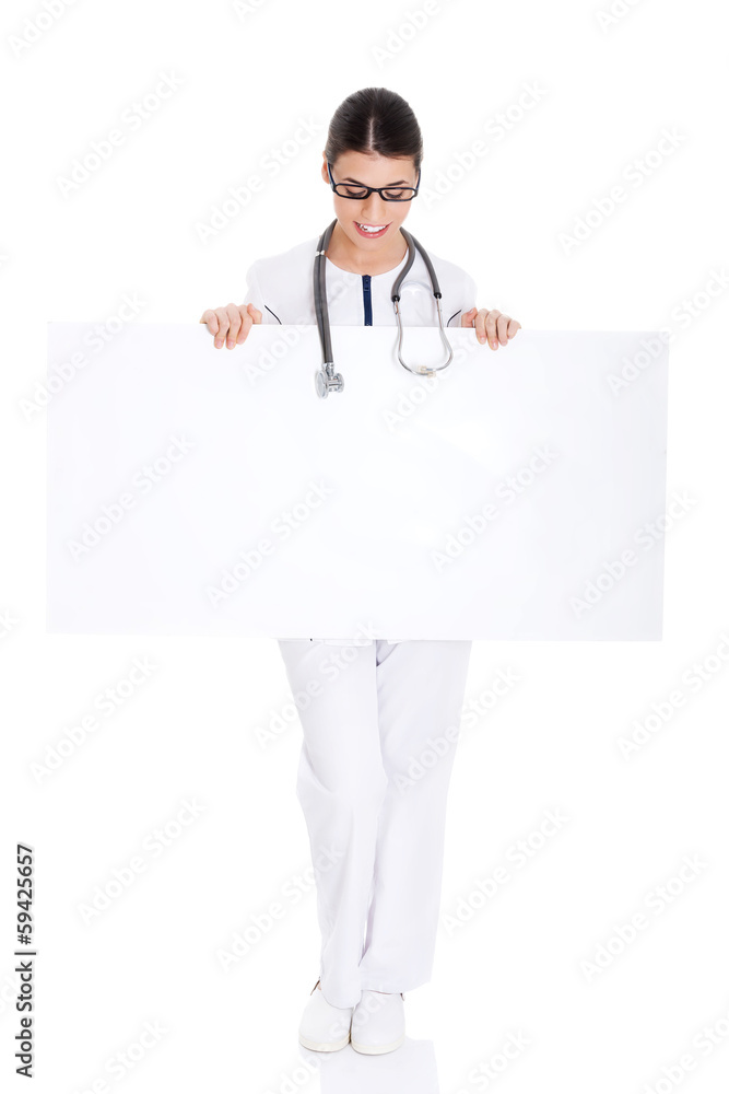 Young female doctor holding copy space. Young female doctor holding copy space.