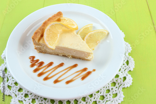 Slice of  lemon cheesecake  and sauce