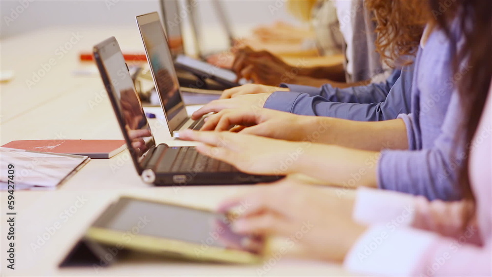 Hands of students with computer in university Hands of students with computer in university