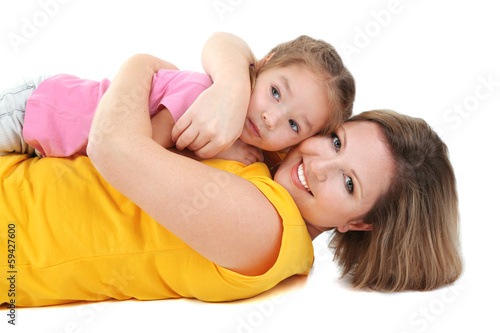 Beautiful mom with little daughter isolated on white
