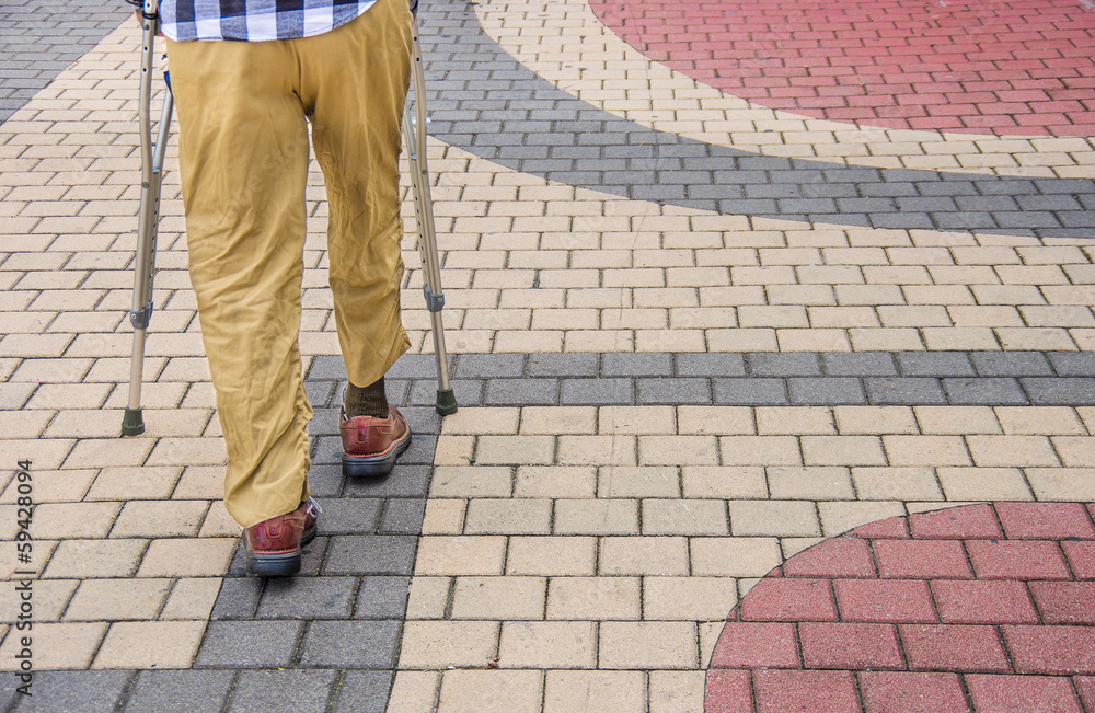 Man walking with crutches