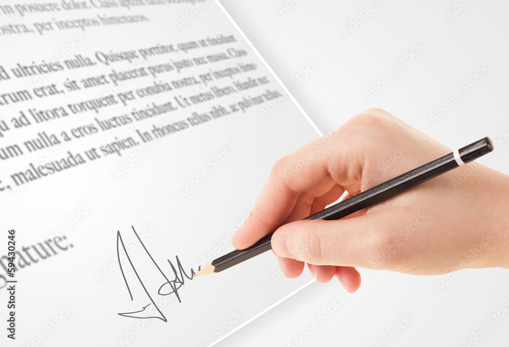 Hand writing personal signature on a paper form Hand writing personal signature on a paper form