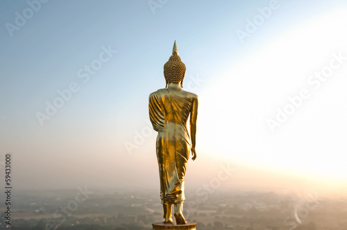 Buddha standing on a mountain Wat Phra That Khao Noi, Nan