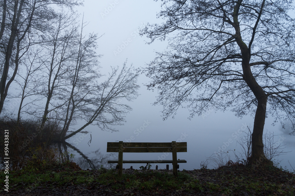 Empty bench at a lake