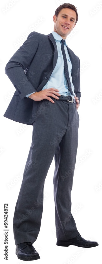 Happy businessman with hands on hips Happy businessman with hands on hips