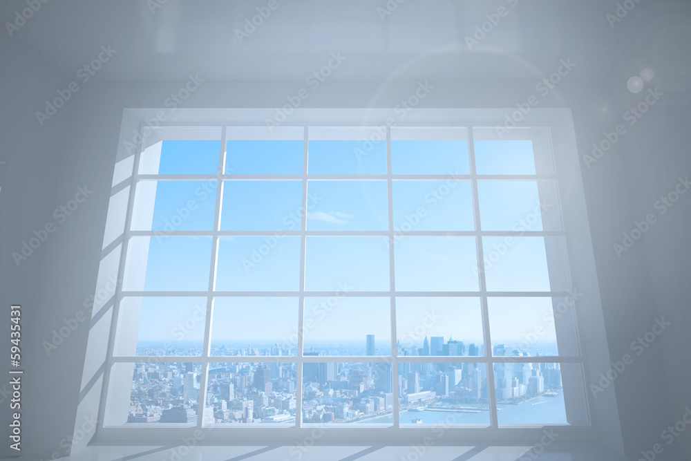 Room with large window showing city Room with large window showing city