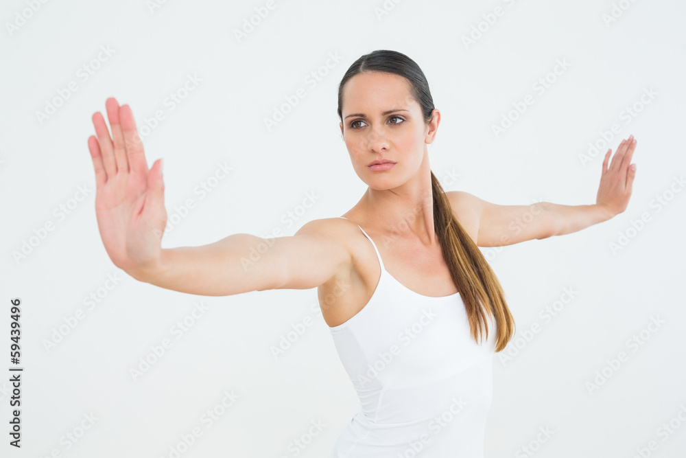 Concentrated fit young woman doing pilate exercises Concentrated fit young woman doing pilate exercises