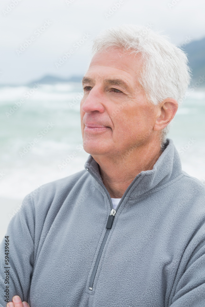 Senior man looking away at beach Senior man looking away at beach