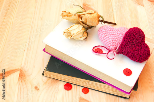 old vintage books and knitted hearts