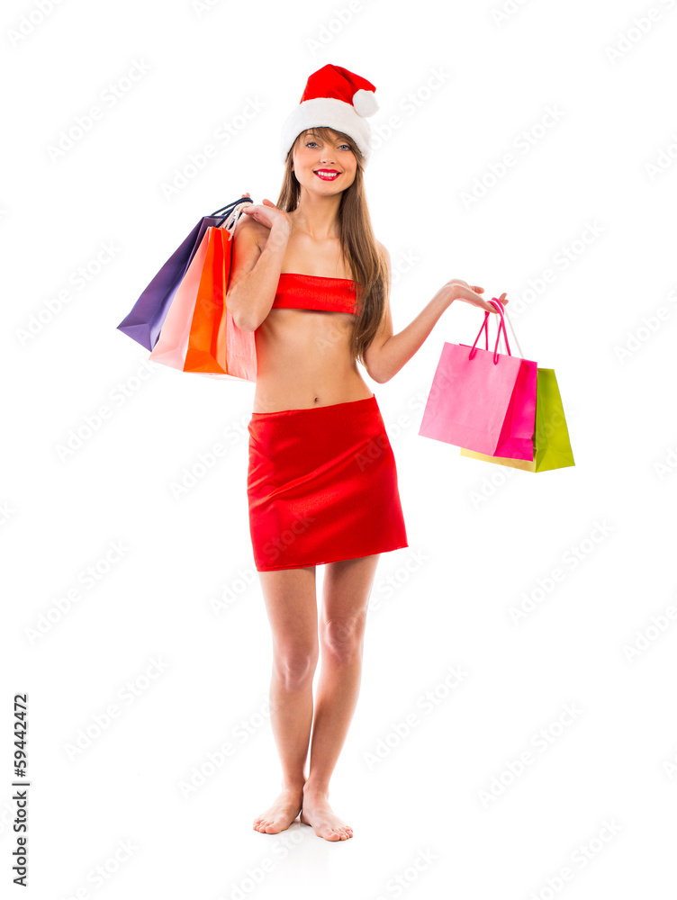Beautiful Santa christmas girl with shopping bags on white Beautiful Santa christmas girl with shopping bags on white