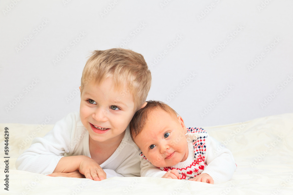portrait of little boy with newborn sister portrait of little boy with newborn sister