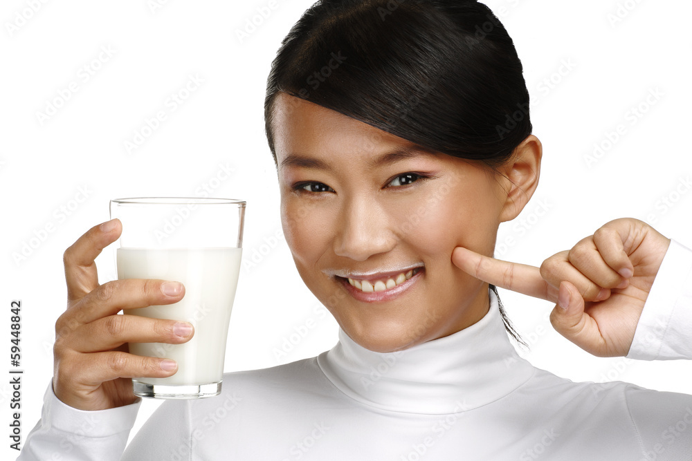 Young happy asian woman drink fresh milk