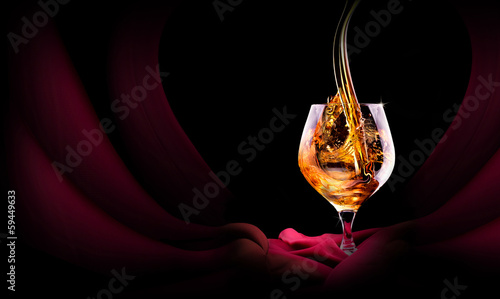 Foto Cognac or brandy on a black