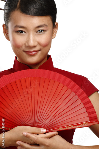 Traditional asian woman holding a red beautiful fan