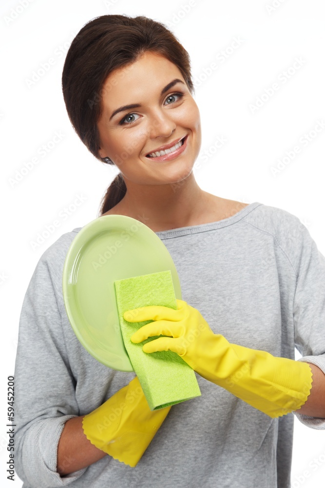 Beautiful cheerful brunette woman in gloves cleaning plate Beautiful cheerful brunette woman in gloves cleaning plate