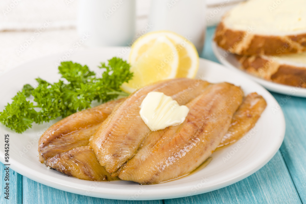 Smoked Kippers - Butterfly smoked herring served with bread. Smoked Kippers - Butterfly smoked herring served with bread.