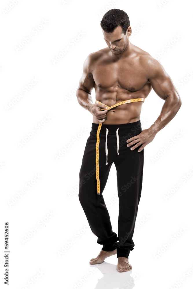 Fototapeta premium Muscle man taking is measures