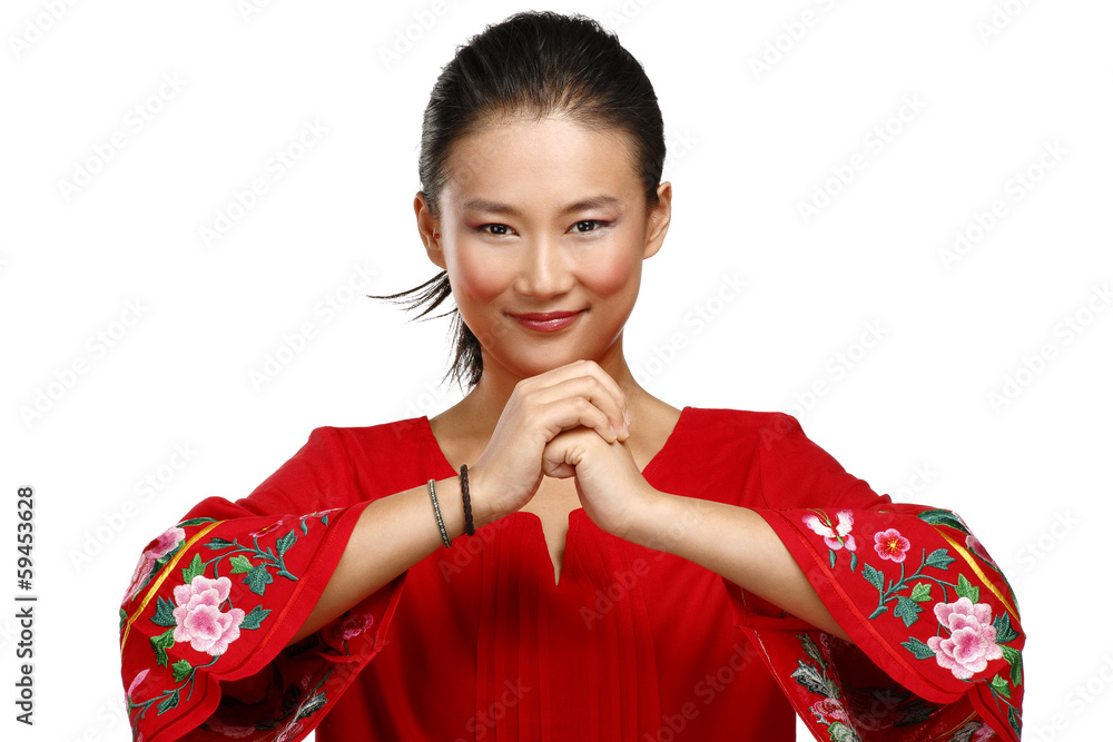 Chinese woman greeting gesture in elegant red dress Chinese woman greeting gesture in elegant red dress