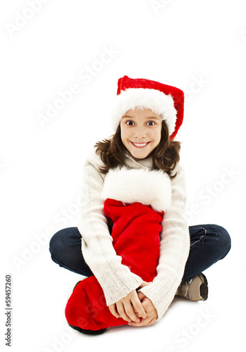 Little girl with Christmas gift on white background