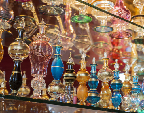 Ornate perfume bottles on a shelf
