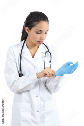Arab female doctor putting latex gloves
