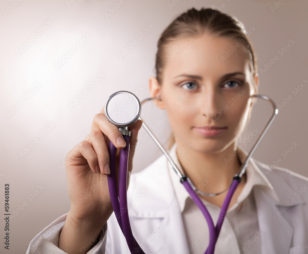 Close-up of female doctor using stethoscope Close-up of female doctor using stethoscope