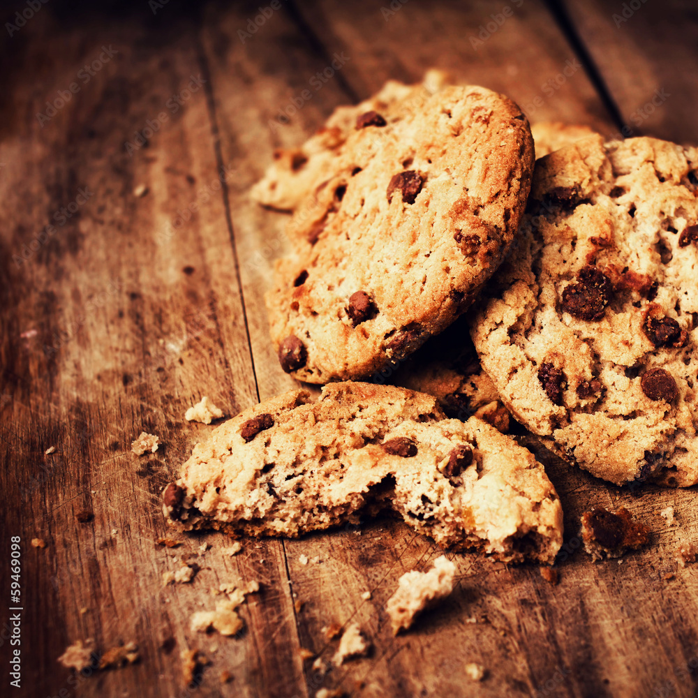 Stacked chocolate chip cookies on wooden table. Chocolate cookie Stacked chocolate chip cookies on wooden table. Chocolate cookie