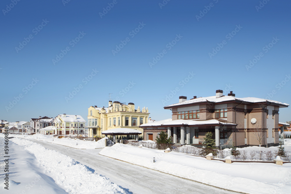 Street in small cottage settlements in winter frosty and sunny
