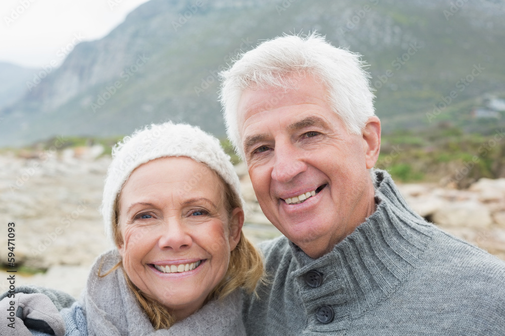 Senior couple together on rocky landscape