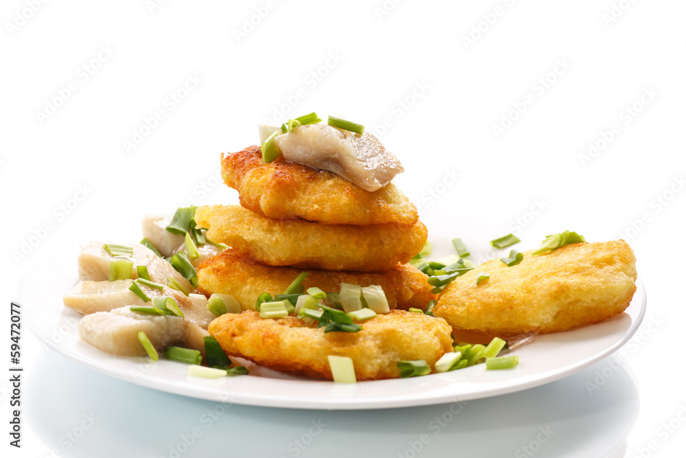 potato pancakes with herring and onion