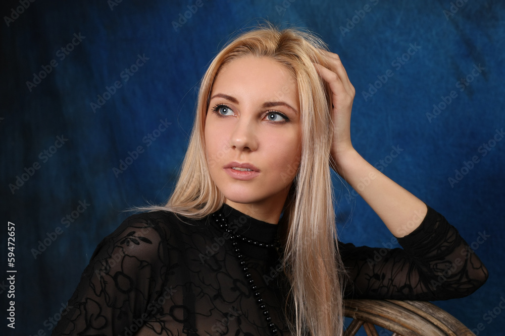Beautiful blonde on a blue background Beautiful blonde on a blue background