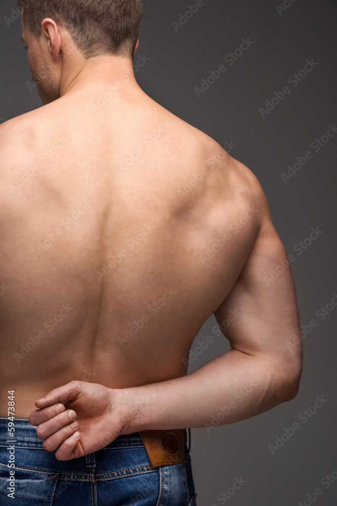Close up of sexy male nude muscular back. Close up of sexy male nude muscular back.