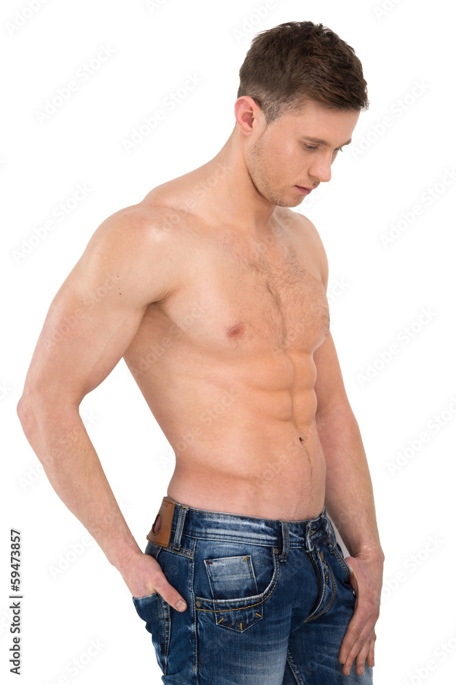Sexy naked male model standing in jeans only. Sexy naked male model standing in jeans only.