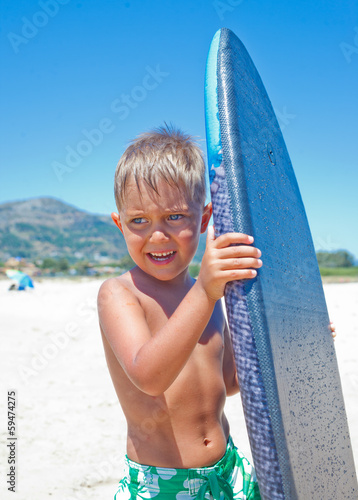 Boy has fun with the surfboard