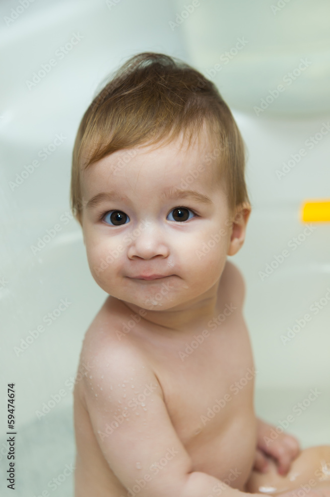 Nine months baby girl bathing in the bathroom Nine months baby girl bathing in the bathroom