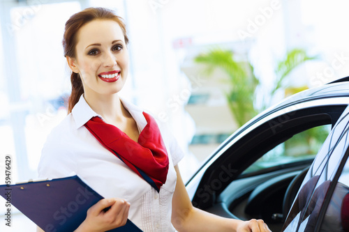 Woman consultant at car salon