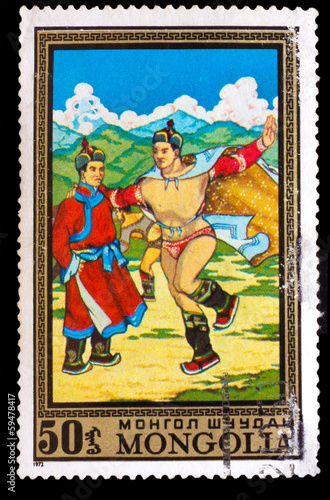 CIRCA 1972: A stamp printed by MONGOLIA , Two men dan