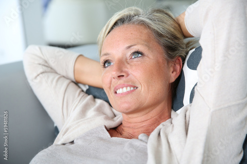 Portrait of mature attractive woman relaxing at home