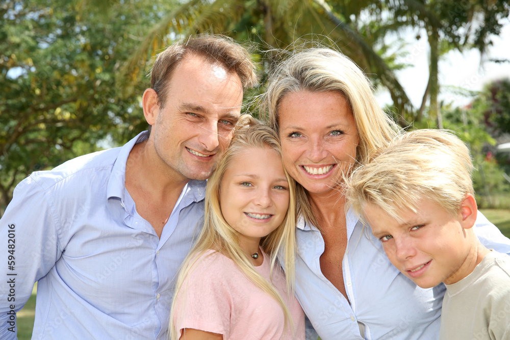 Portrait of happy family standing outside Portrait of happy family standing outside