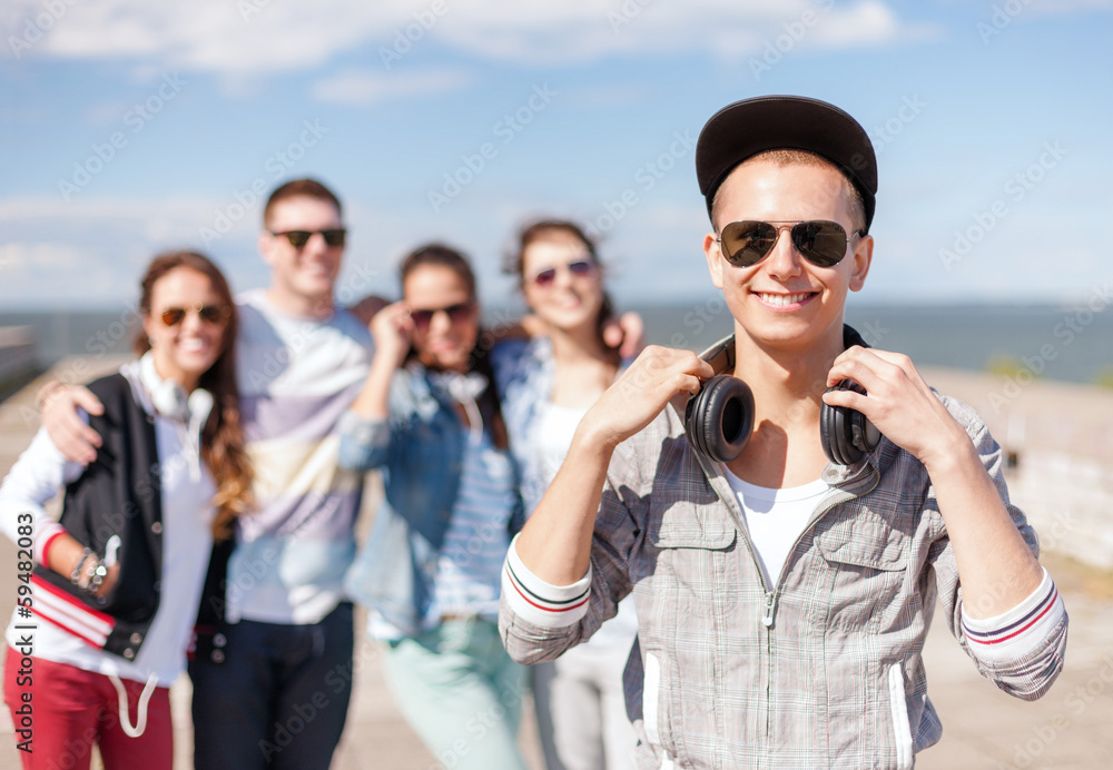 teenage boy with sunglasses and friends outside teenage boy with sunglasses and friends outside