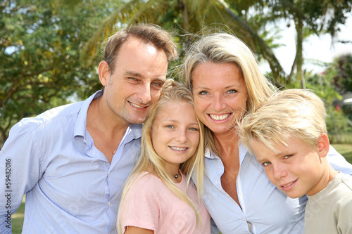 Portrait of happy family standing outside © goodluz